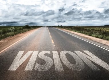 a road with the word vision written on it