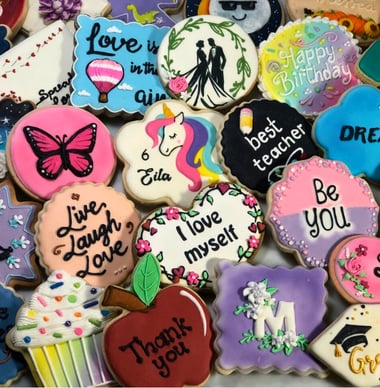 Beautifully decorated cookies with royal icing designs for various occasions custom-made for birthdays, weddings, baby shower
