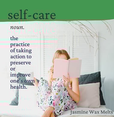 Cayla Henri: a woman sitting on a couch with a book in front of her face