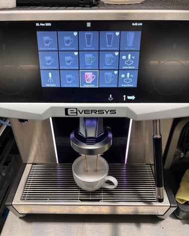 Eversys Cameo espresso machine brewing a fresh latte in a South Florida location