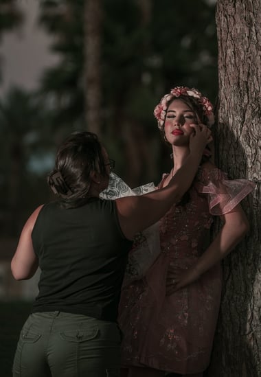 a woman helping te model