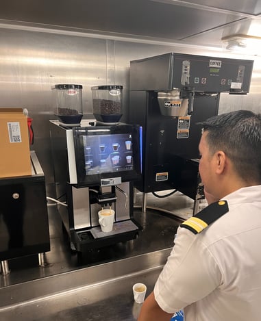 Technician calibrating Schaerer espresso machine on a cruise ship in South Florida