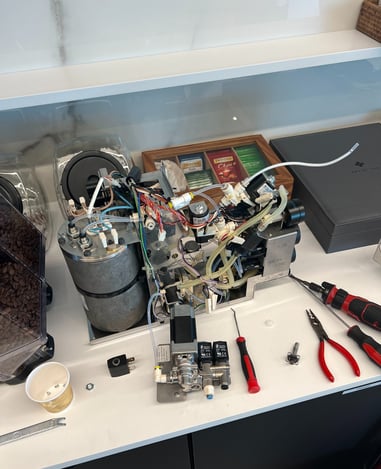 coffee-machine-opened-for-repair-and-troubleshooting.jpg