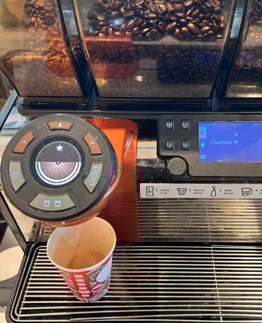 Mastrena espresso machine with double shot selected and brewing in progress