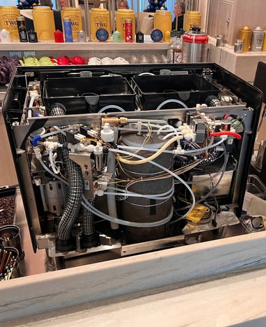 Steam boiler being replaced during repair of espresso machine in South Florida