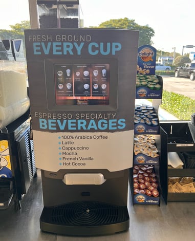 De Jong Duke self-serve coffee machine displaying espresso and specialty beverage options