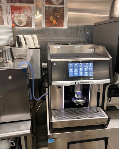 Eversys Cameo espresso machine installed in a commercial kitchen.