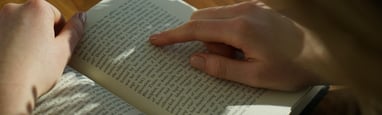 Reading a book. Enhancing emotional literacy. Mindletic Blog.