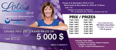 a woman in a blue dress standing behind a prize