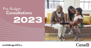 a woman and her daughter are sitting on a couch