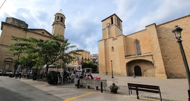 Main square of L'Espluga de Francoli with buildings of The church of Sant Miquel or Old Church