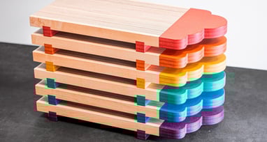 Serving boards created with scrap wood and colored MDF, perfect for cheese or sushi boards