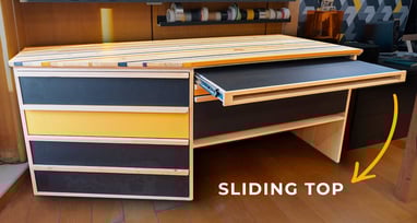 Cabinet made with colored MDF, sliding top and angled drawers to open by a window