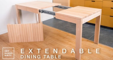 A table with its extendable parts is visible. It sits 2 or 4 people when closed and 10 when extended