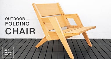 A folding chair sitting outside.