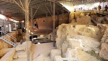 Ancient ruins under a cover in a small Roman Theater museum are 2 minutes walk from tram 28 stop
