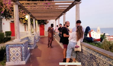 People enjoying sunset at Portas do Sol, located right on tram 28 route.