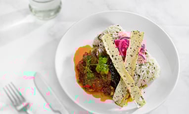 a plate of food with a fork and knife on a table