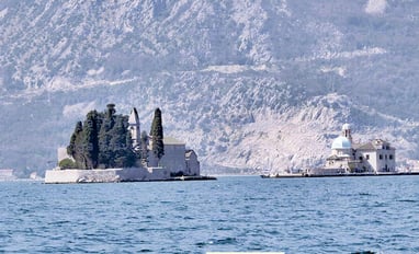 2 magnificent islands of Bay of Kotor: one with a blue cupola & the second with a stone church