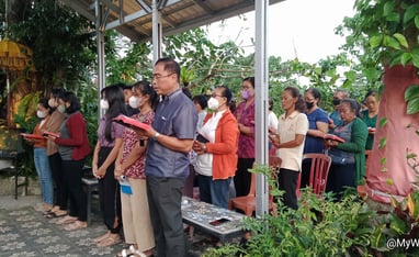a group of people standing in line at a church