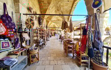 a long narrow aisle with a variety of handmade items Ledra North Cyprus
