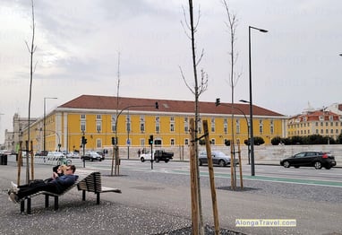 People relaxing on on a bench in an area of Lisbon built for relaxation during Pombaline reforms