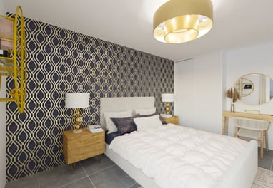 a bedroom with a bed and a desk with a lamp