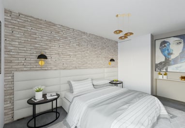 a bedroom with a brick wall and a bed