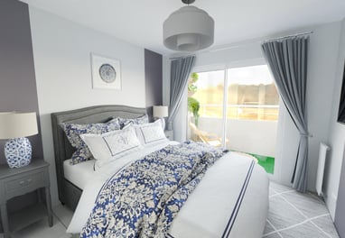 a bedroom with a bed and a lamp