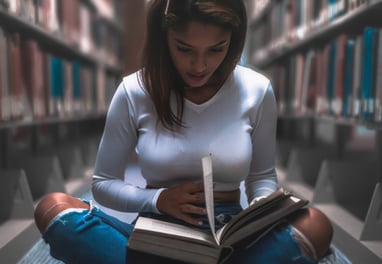 Woman reading a bbook and enjoying some therapeutic moments while reading
