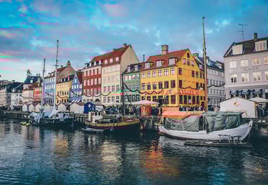 Colorful houses along the River in Copenhagen, the cheapest city in Europe to fly into