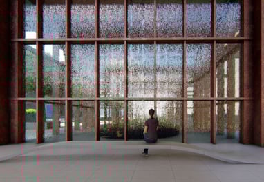 a person standing in front of a large window