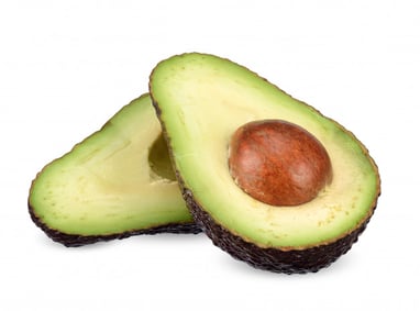 Avocado split in half the longways overlapping each other