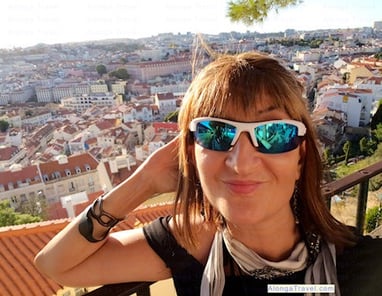 Alonga Travel the author enjoys rooftops view of Alfama from Miradouro da Graça near tram 28 stop
