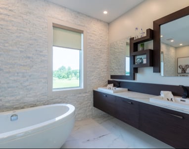 a bathroom with a tub tub and a large mirror