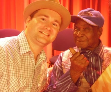Giving some blues folk art to David "Honeyboy" Edwards