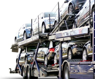 a truck with a large load of cars on it