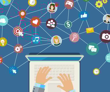 a person's hands on a laptop computer using content-driven selling channels