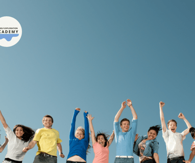 a group of people standing in a line with their hands up in the air