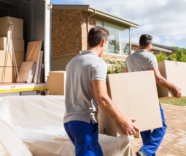 Professional Movers with Boxes and Truck