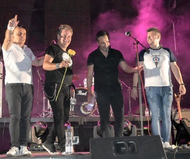 a group of men standing on a stage