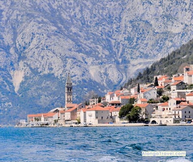 Enormous steep white ⛰ backdropping a charming town on Bay of Kotor