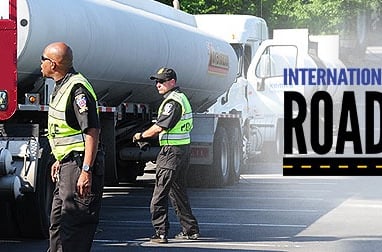 police dot officers inspecting truck