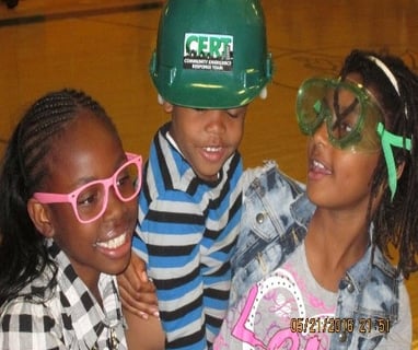 three young children wearing safety glasses and safety glasses