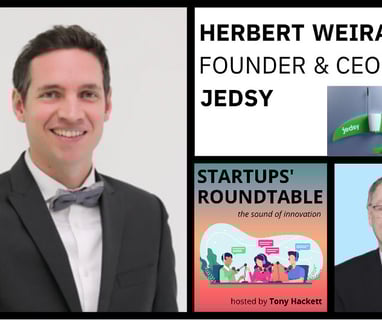 a startup founder in a suit and bow tie with a business card