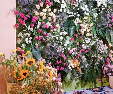 a large flower arrangement in a room with a rug rug