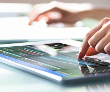 A woman working with a dashboard on a tablet