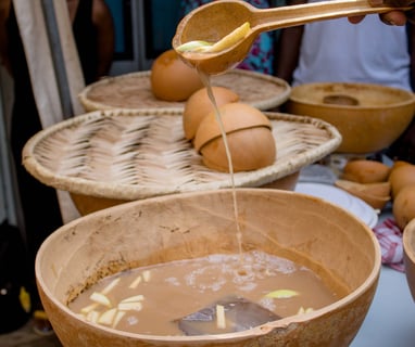 A calabash of ice cold lamougin with slices of apple