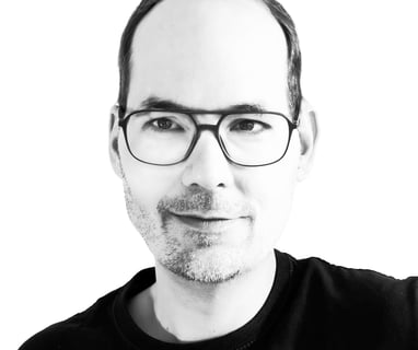 a man with glasses and a beard