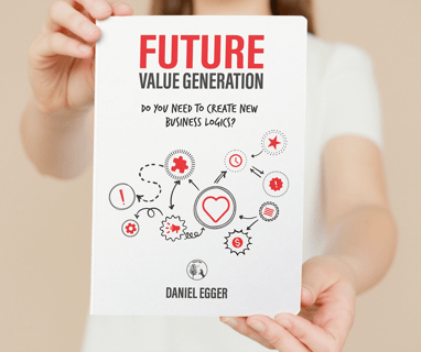 a woman holding up a book about the future of a business